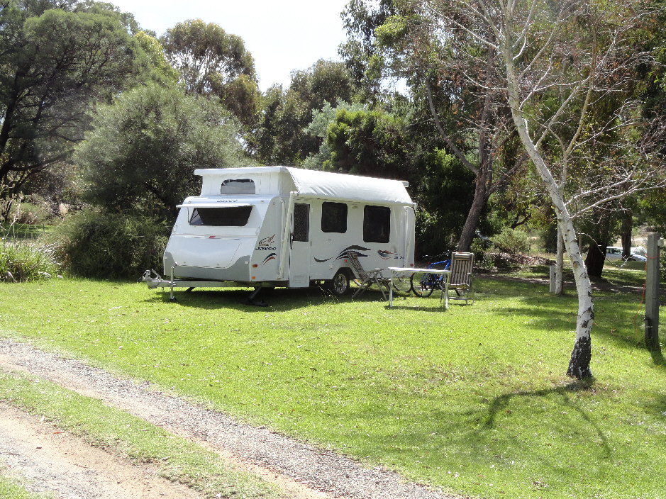 South 1 a premier powered site with fireplace that suits caravans, motor homes, camper trailors and tents at Grampians Paradise Camping and Caravan Parkland