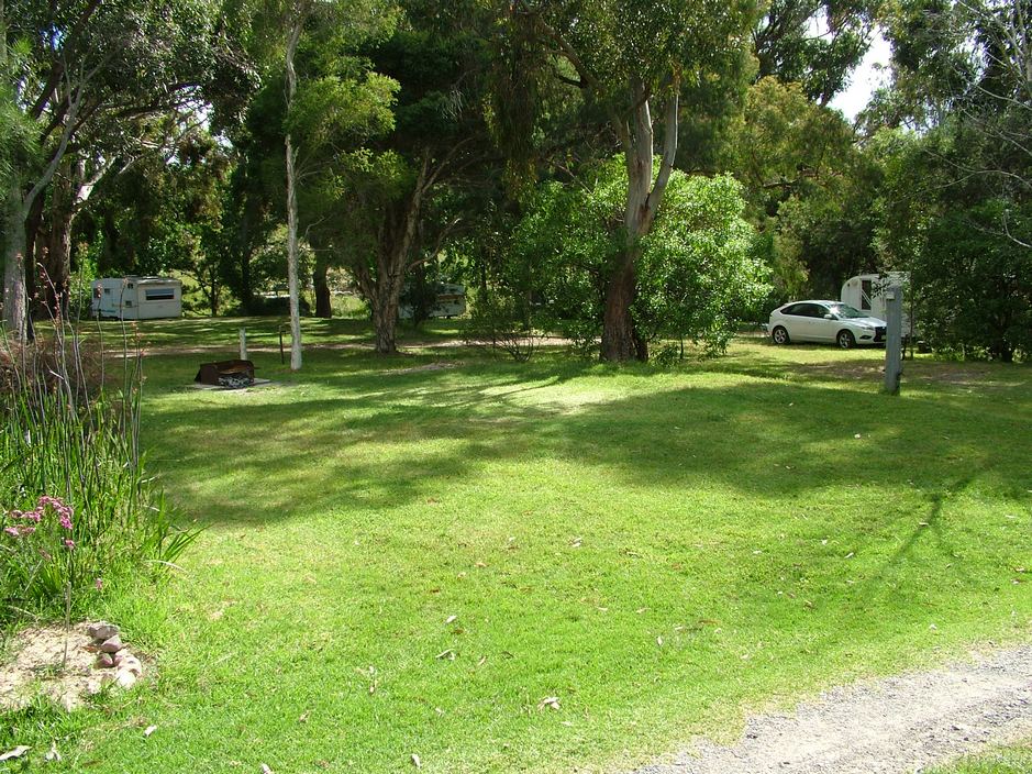 South 1 a premier powered site with fireplace that suits caravans, motor homes, camper trailors and tents at Grampians Paradise Camping and Caravan Parkland