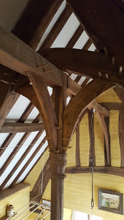 Traditional framed roof using mortises and tenons and timber pins to hold the building together. Built by Rob Hadden